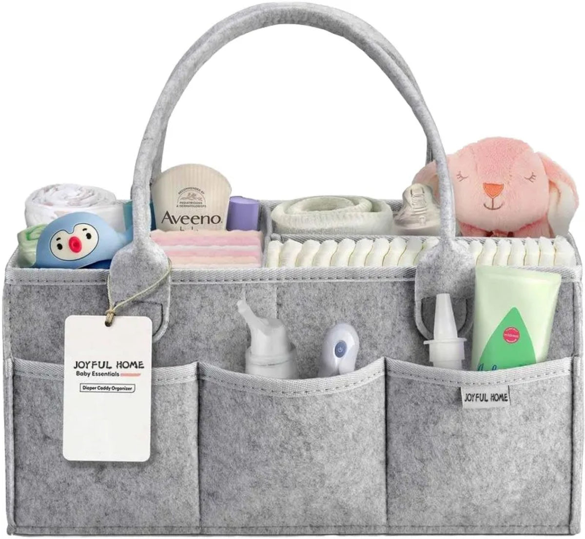 Supplier reference photograph of a light grey felt diaper caddy with external pockets and handles. Exact LEONO sample and branding pending; contents are styling props.